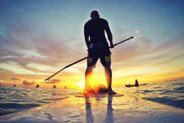 man on stand-up paddle board